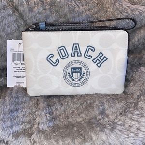 Coach Corner Zip Wristlet In Signature Canvas With Varsity Motif